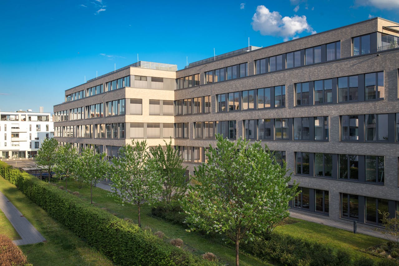 Office building with park or garden in summer 2023